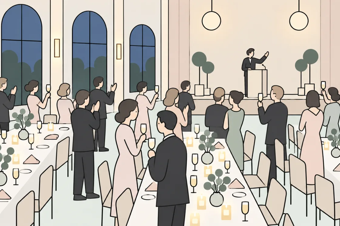 Guests raise their glasses and applaud during a speech at the lectern